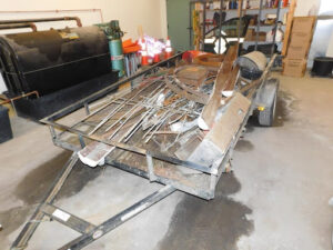 Utility trailer with scrap metal after it was recovered on Downer Road in Sharon.