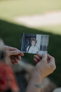 Michelle holds a photo of young Chrissy