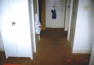 Section of carpeting inside the apartment later removed for analysis.