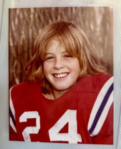 Patrick as a kid in his Pop Warner Football uniform