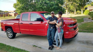 Luc and Valerie Tieman pictured in front of the red truck he claimed Valerie got out of on the night she disappeared, source: Maine State Police